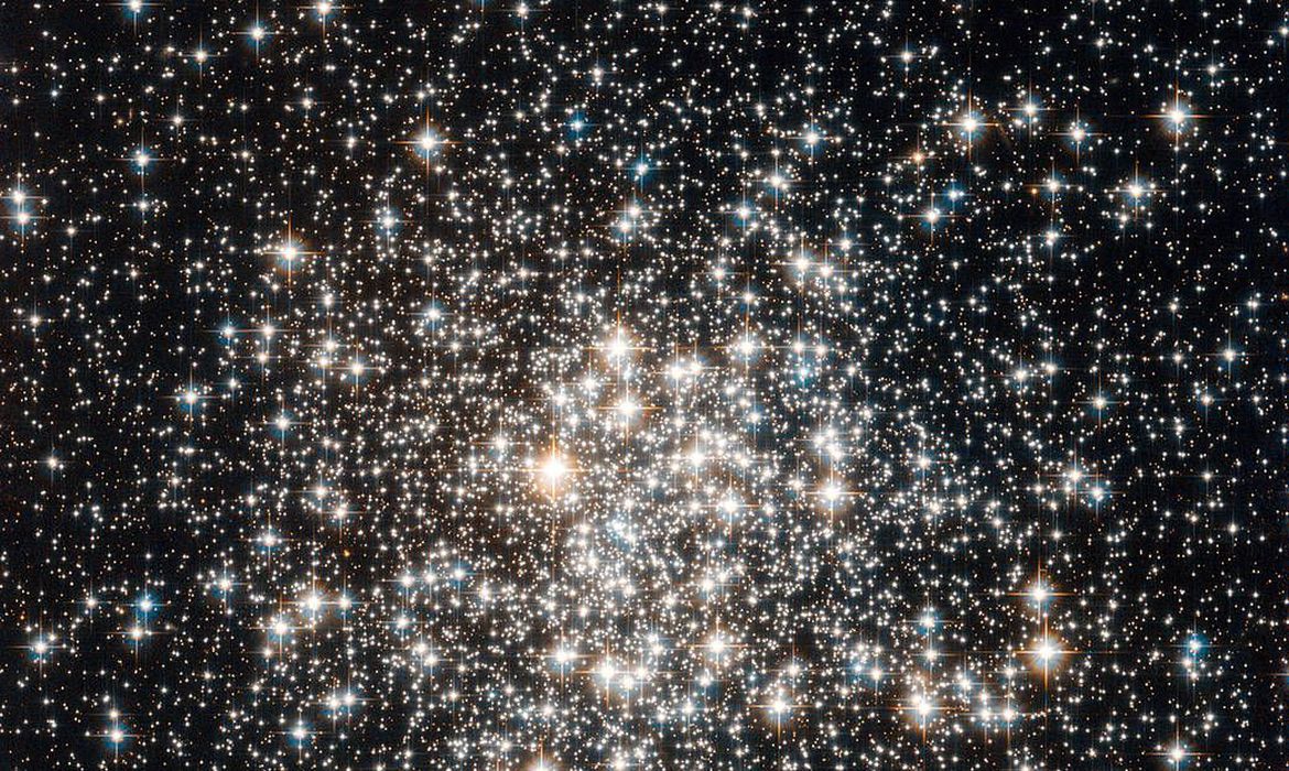 The NASA/ESA Hubble Space Telescope has captured a crowd of stars that looks rather like a stadium darkened before a show, lit only by the flashbulbs of the audience’s cameras. Yet the many stars of this object, known as Messier 107, are not a fleeting phenomenon, at least by human reckoning of time — these ancient stars have gleamed for many billions of years. Messier 107 is one of more than 150 globular star clusters found around the disc of the Milky Way galaxy. These spherical collections each contain hundreds of thousands of extremely old stars and are among the oldest objects in the Milky Way. The origin of globular clusters and their impact on galactic evolution remains somewhat unclear, so astronomers continue to study them through pictures such as this one obtained by Hubble. As globular clusters go, Messier 107 is not particularly dense. Visually comparing its appearance to other globular clusters, such as Messier 53 or Messier 54 reveals that the stars within Messier 107 are not packed as tightly, thereby making its members more distinct like individual fans in a stadium's stands. Messier 107 can be found in the constellation of Ophiuchus (The Serpent Bearer) and is located about 20 000 light-years from the Solar System. French astronomer Pierre Méchain first noted the object in 1782, and British astronomer William Herschel documented it independently a year later. A Canadian astronomer, Helen Sawyer Hogg, added Messier 107 to Charles Messier's famous astronomical catalogue in 1947. This picture was obtained with the Wide Field Camera of Hubble’s Advanced Camera for Surveys. The field of view is approximately 3.4 by 3.4 arcminutes.