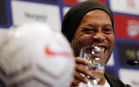 epa07926265 Former Brazilian soccer player Ronaldinho Gaucho attends a press conference, in Bogota, Colombia, 16 October 2019. Ronaldinho arrived in Colombia to play two exhibition matches in Bogota and Cali. The first one will be played at the Nemesio Camacho El Campin stadium, where the Brazilian star will wear the shirt of Independiente Santa Fe in the game against Atletico Nacional. The second match will be in Cali, in the classic between America and Deportivo Cali, at the Pacual Guerrero stadium, where Gaucho will play one half with each team.  EPA/Mauricio Duenas Castaneda