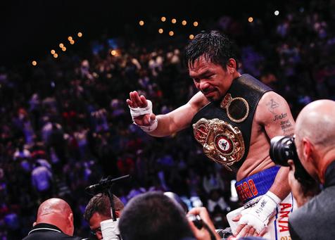 epa07730567 Manny Pacquiao of the Philippines celebrates his victory against Keith Thurman of the US after their WBA Super Welterweight World Championship title fight at MGM Grand Garden Arena in Las Vegas, Nevada, USA, 20 July 2019.  EPA/ETIENNE LAURENT