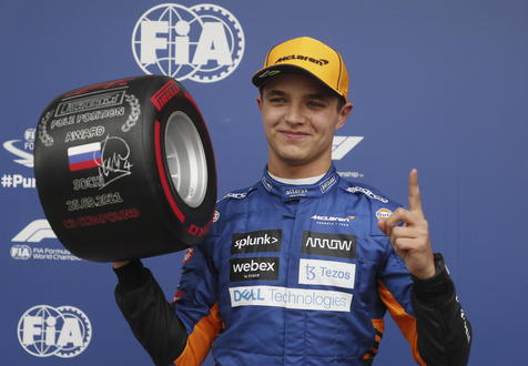 epa09487375 British Formula One driver Lando Norris of the McLaren F1 Team celebrates after taking pole position during the qualifying session of the 2021 Formula One Grand Prix of Russia at the Sochi Autodrom race track in Sochi, Russia, 25 September 2021. The Formula One Grand Prix of Russia will take place on 26 September 2021.  EPA/Yuri Kochetkov / POOL