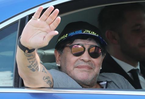 epa06892939 Argentinian soccer legend Diego Maradona waves upon his arrival at Brest airport, Belarus, 16 July 2018. Maradona has been appointed as chairman of Belarussian soccer club 'Dinamo Brest'.  EPA/TATYANA ZENKOVICH