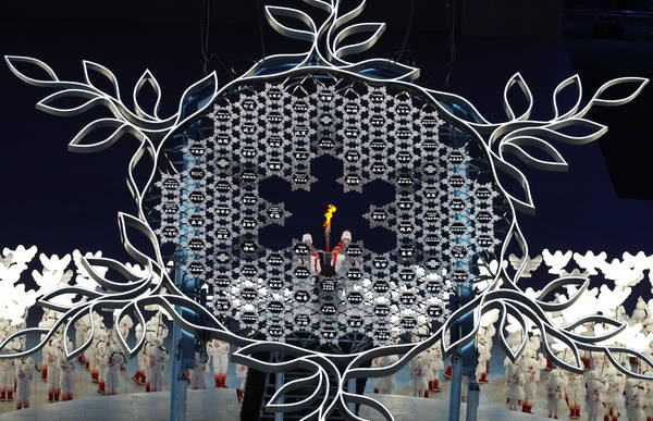 epa09727707 The Lighting of the Olympic Cauldron during the Opening Ceremony for the Beijing 2022 Olympic Games at the National Stadium, also known as Bird's Nest, in Beijing China, 04 February 2022.  EPA/ROMAN PILIPEY