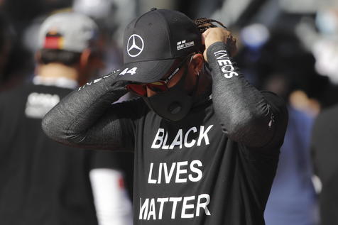 epa08700832 British Formula One driver Lewis Hamilton of Mercedes-AMG Petronas wears a shirt reading 'Black Lives Matter' on the grid prior to the 2020 Formula One Grand Prix of Russia at the race track in Sochi, Russia, 27 September 2020.  EPA/Maxim Shemetov / Pool