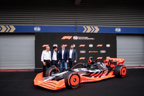 epa10139484 (L-R) CEO of Formula One Group Stefano Domenicali, President of FIA Mohammed Bin Sulayem, Audi Chief Development Officer Oliver Hoffmann, and Chairman of the executive board of German manufacturer Audi Markus Duesmann pose next to the new Audi F1 car following a press conference of the Formula One Grand Prix of Belgium at the Spa-Francorchamps race track in Stavelot, Belgium, 26 August 2022. The Belgian Formula One Grand Prix will take place on 28 August 2022. Audi announced they will enter Formula One in 2026.  EPA/CHRISTIAN BRUNA