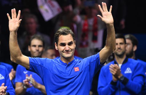 epaselect epa10202794 Team Europe player Roger Federer of Switzerland waves to the crowd after playing the doubles match with Rafael Nadal (rear L) of Spain against Team World double Jack Sock of the US and Frances Tiafoe of the US on the first day of the Laver Cup tennis tournament in London, Britain, 23 September 2022. The match was Federer's last game before retirement.  EPA/ANDY RAIN