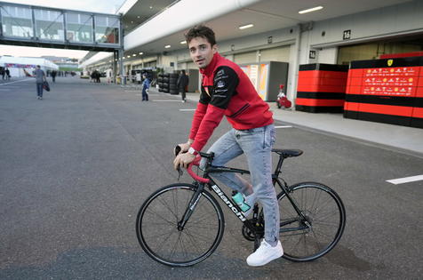 epa10226324 Monaco's Formula One driver Charles Leclerc of Scuderia Ferrari cycles through the paddock ahead of the Japanese Formula One Grand Prix in Suzuka, Japan, 06 October 2022. The Japanese Formula One Grand Prix will take place on 09 October 2022.  EPA/FRANCK ROBICHON