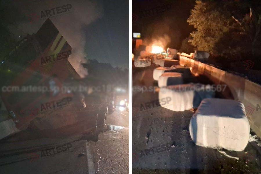 Carreta tomba, espalha carga de algodão e pega fogo na Cônego, em Santos